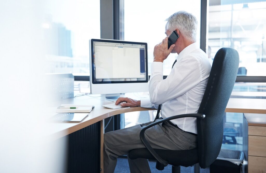 man on the phone in office